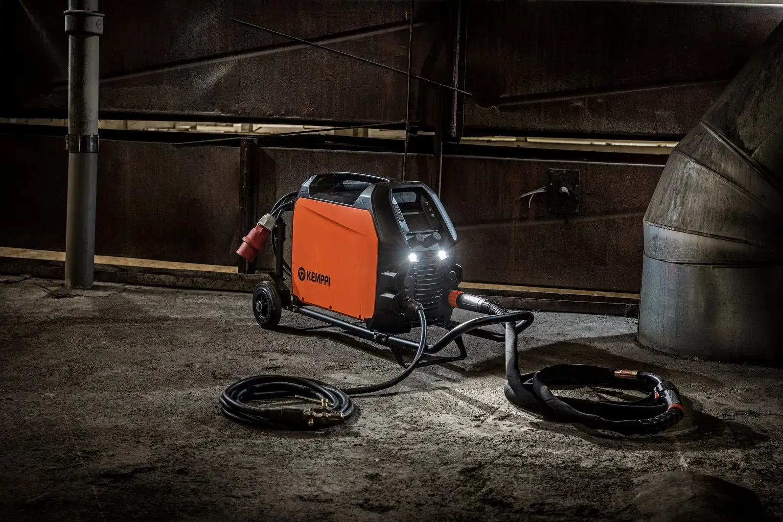 A Master M in a dark workshop with its LED work lights on