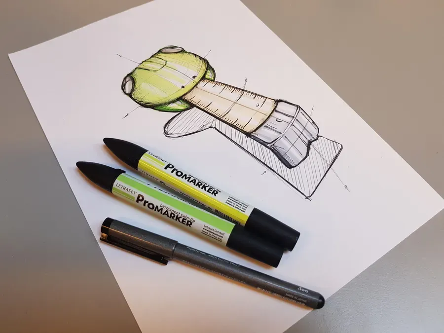 Marker sketch of a product concept, with the pens beside it
